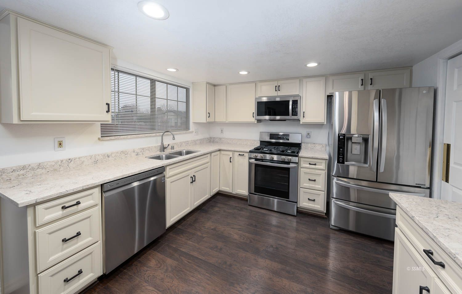 800 Valarie Street Ridgecrest, CA 93555 - Photo 7 of 39 a kitchen with granite countertop a sink stainless steel appliances and cabinets