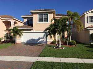 6397 Adriatic Way Greenacres, FL 33413 - Photo 1 of 29 a front view of a house with a yard and potted plants
