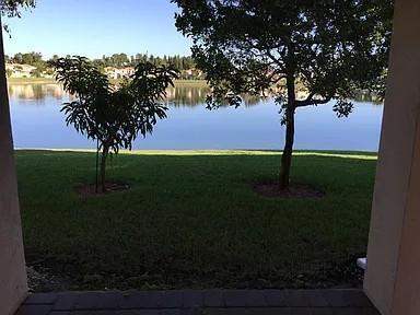 6397 Adriatic Way Greenacres, FL 33413 - Photo 13 of 29 a view of an outdoor space and yard