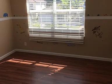 6397 Adriatic Way Greenacres, FL 33413 - Photo 17 of 29 a view of a room with wooden floor and a window