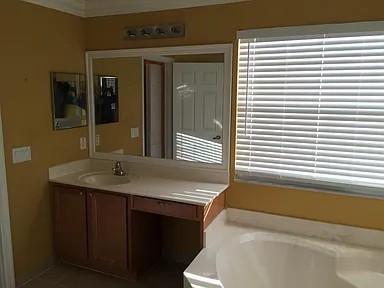 6397 Adriatic Way Greenacres, FL 33413 - Photo 18 of 29 a bathroom with a granite countertop sink and a bathtub
