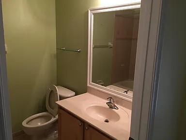 6397 Adriatic Way Greenacres, FL 33413 - Photo 19 of 29 a bathroom with a sink a toilet and shower