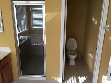 6397 Adriatic Way Greenacres, FL 33413 - Photo 20 of 29 a bathroom with a sink and a toilet