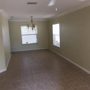 6397 Adriatic Way Greenacres, FL 33413 - Photo 9 of 29 en empty room with windows and entrance