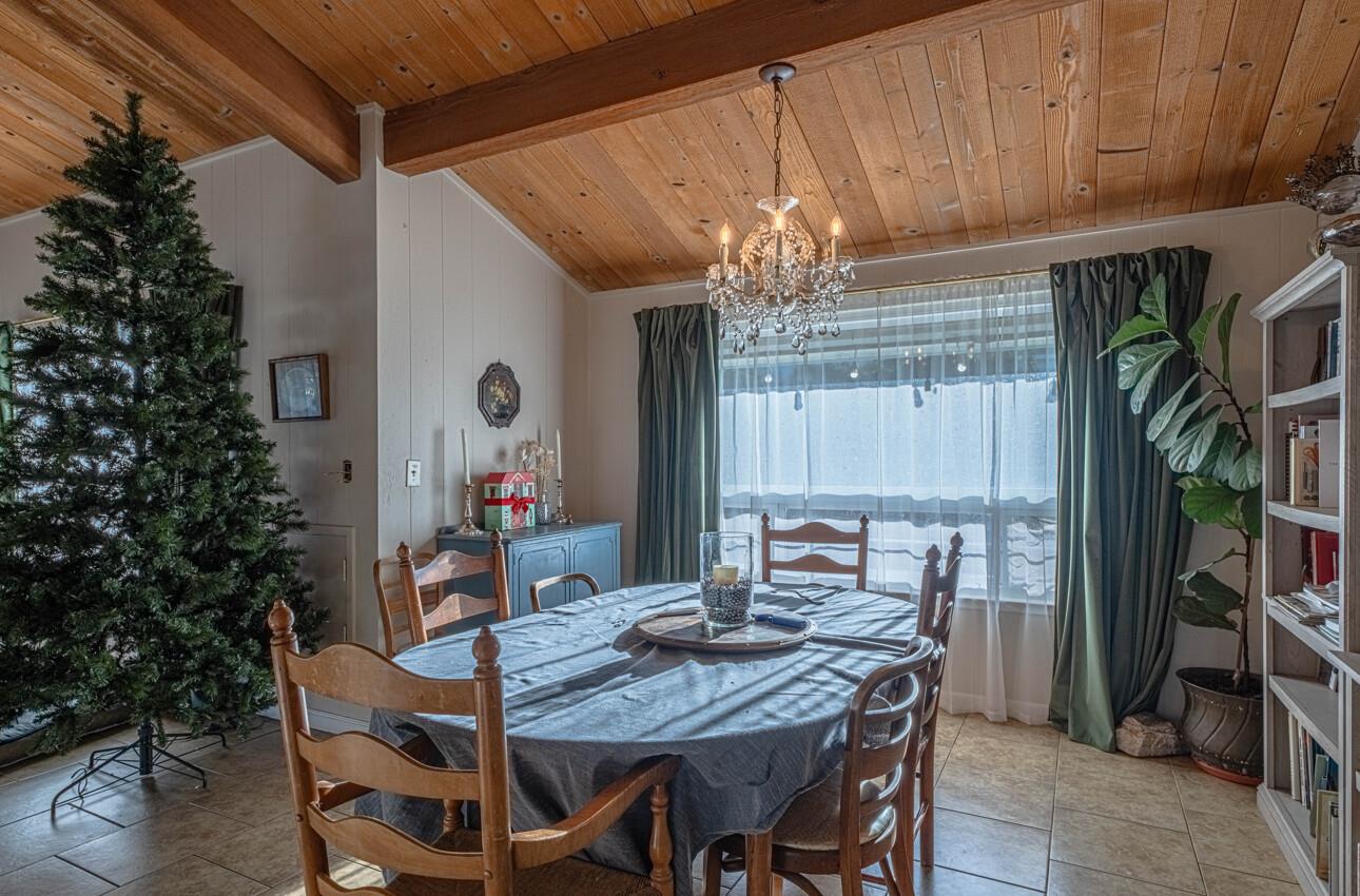 844 River Road Salinas, CA 93908 - Photo 30 of 76 a view of a dining room with furniture a chandelier and wooden floor