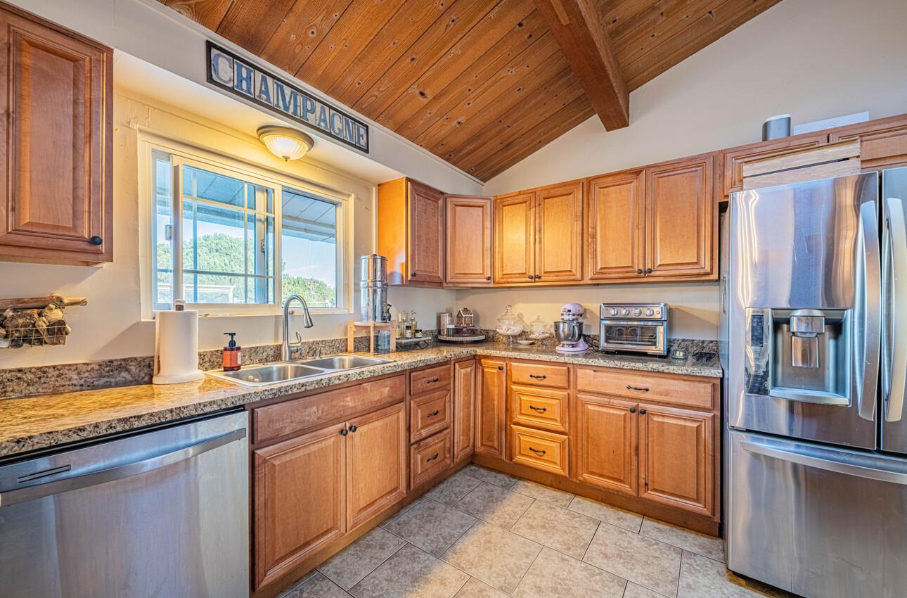 844 River Road Salinas, CA 93908 - Photo 34 of 76 a kitchen with stainless steel appliances granite countertop a sink a stove and cabinets