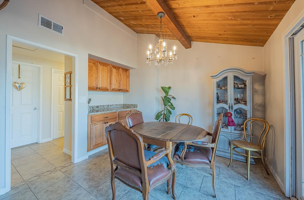 844 River Road Salinas, CA 93908 - Photo 36 of 76 a view of a dining room with furniture and chandelier