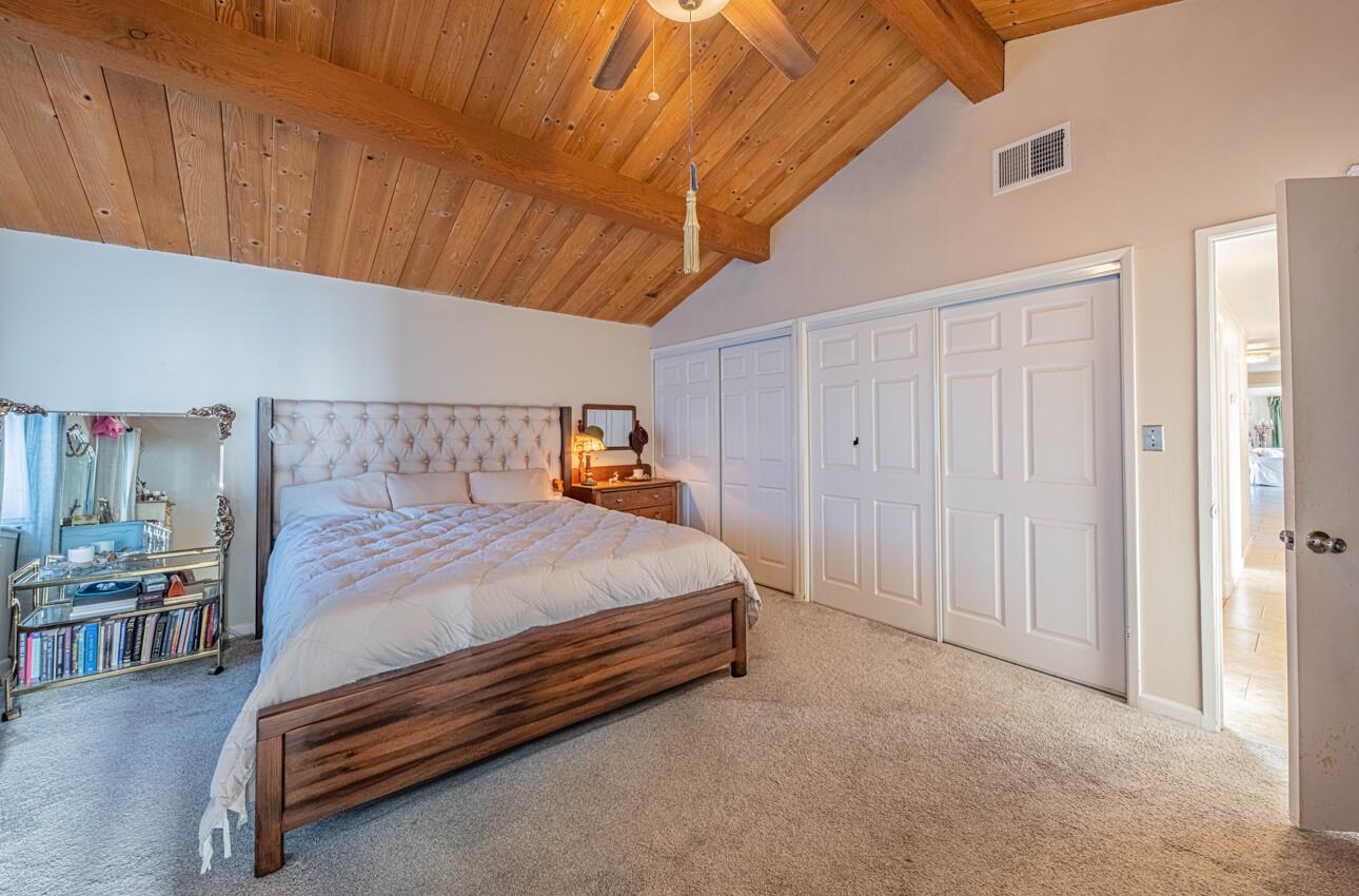 844 River Road Salinas, CA 93908 - Photo 44 of 76 a bedroom with a bed and a night stand