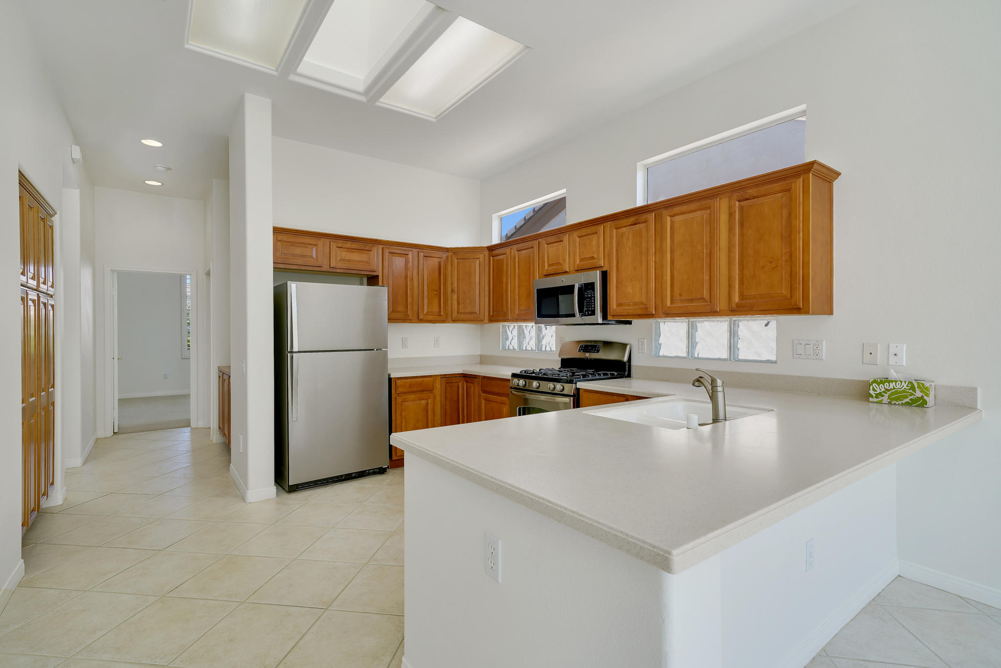 78655 Morning Star Palm Desert, CA 92211 - Photo 11 of 23 a kitchen with a refrigerator a sink and a stove