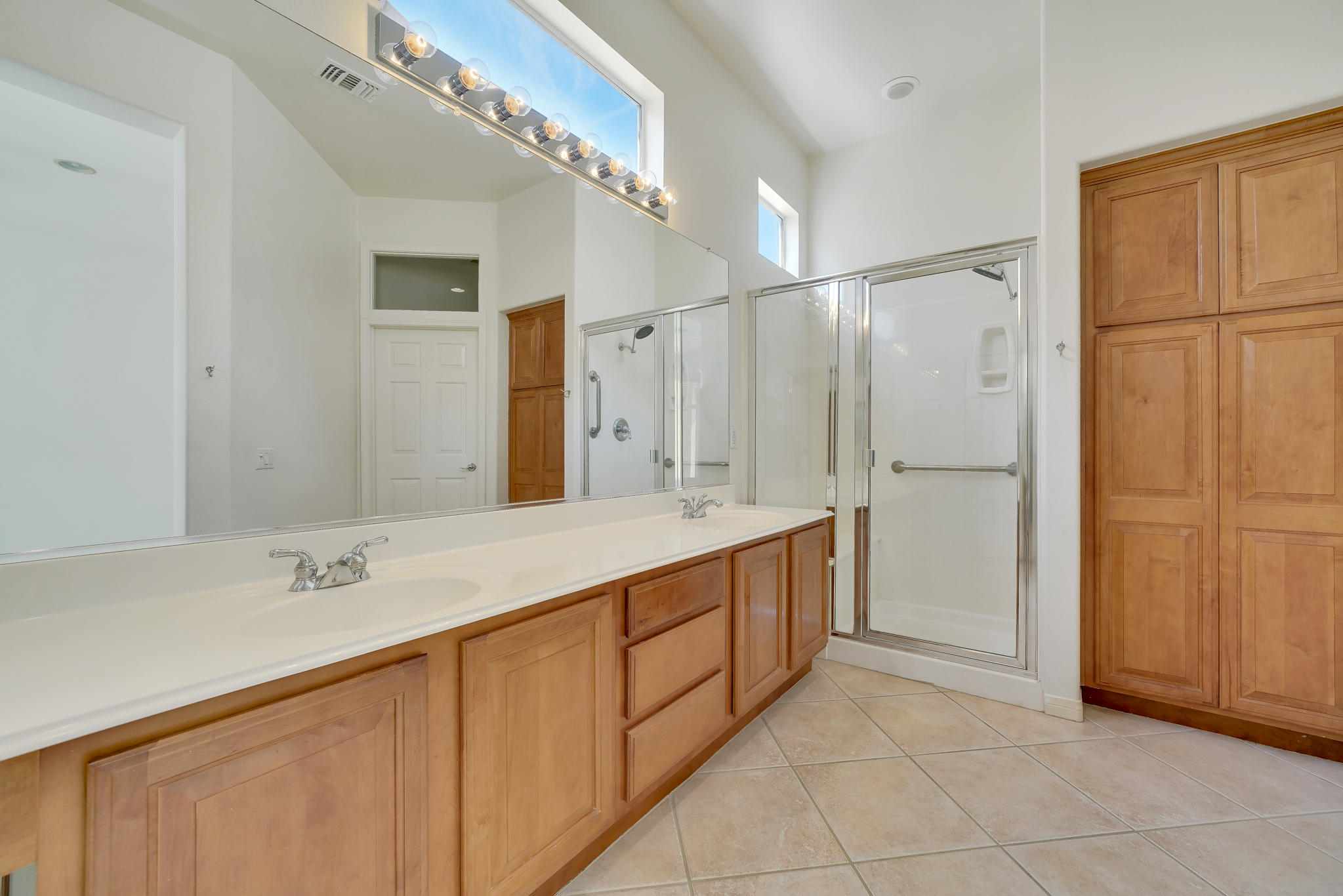 78655 Morning Star Palm Desert, CA 92211 - Photo 16 of 23 a bathroom with a double vanity sink mirror and shower