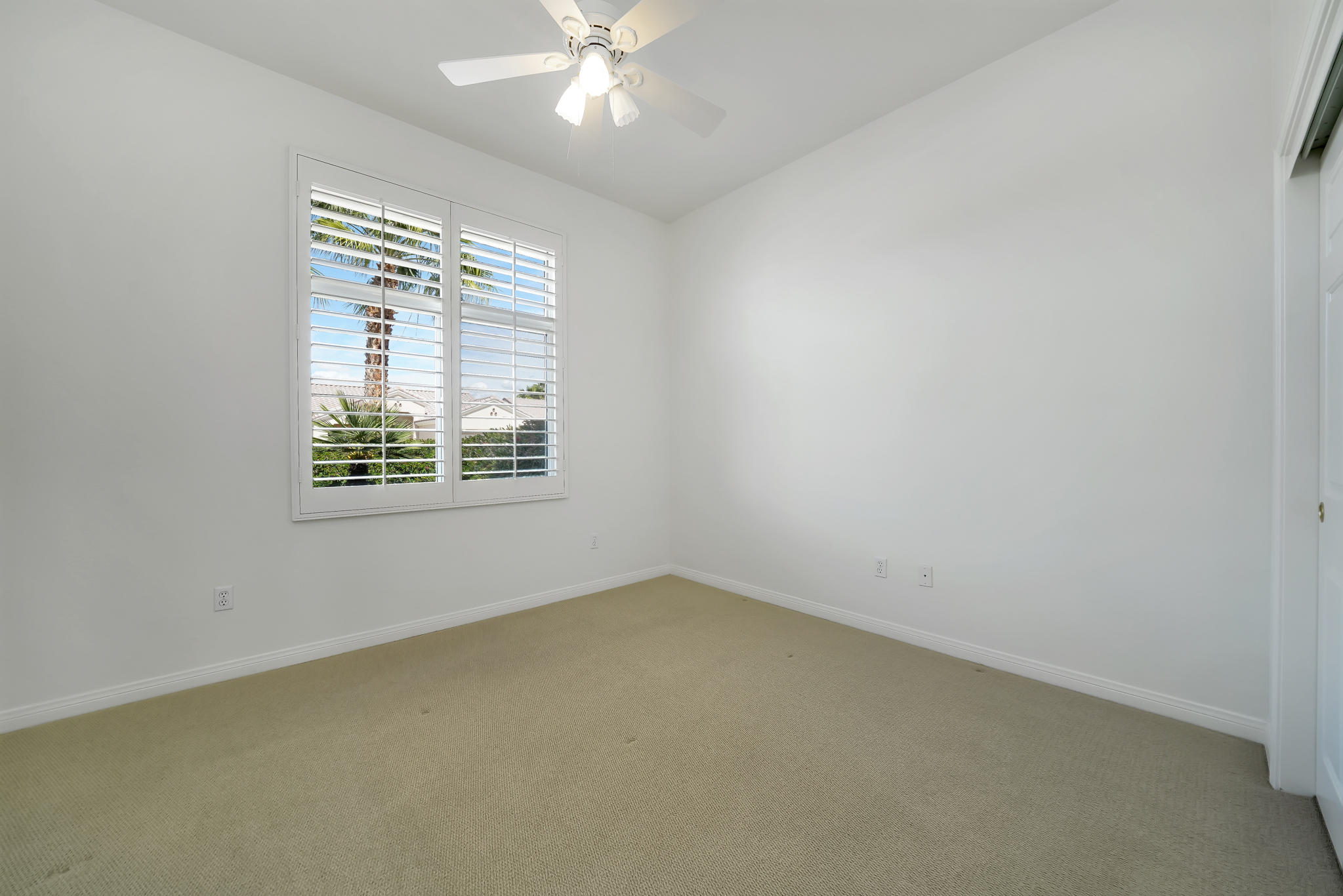 78655 Morning Star Palm Desert, CA 92211 - Photo 17 of 23 an empty room with a window