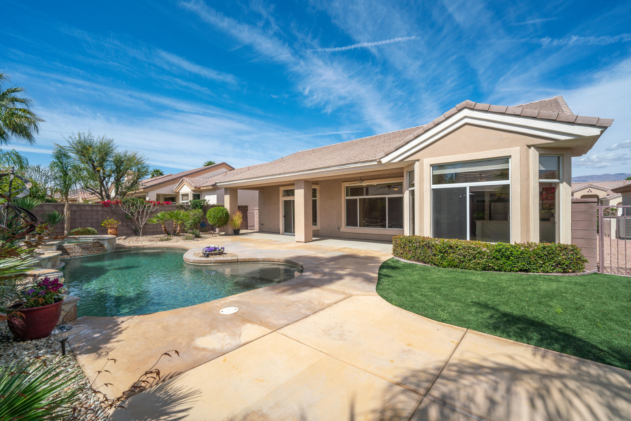 78655 Morning Star Palm Desert, CA 92211 - Photo 4 of 23 a front view of a house with garden