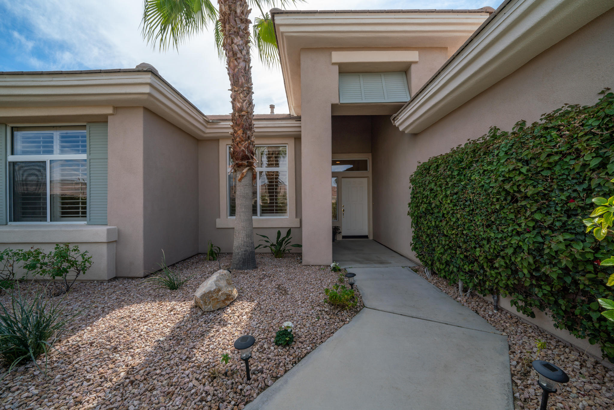 78655 Morning Star Palm Desert, CA 92211 - Photo 6 of 23 a front view of a house with a yard