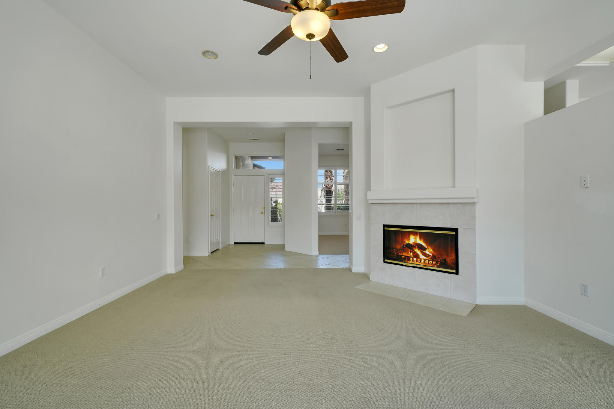 78655 Morning Star Palm Desert, CA 92211 - Photo 9 of 23 an empty room with windows and fireplace