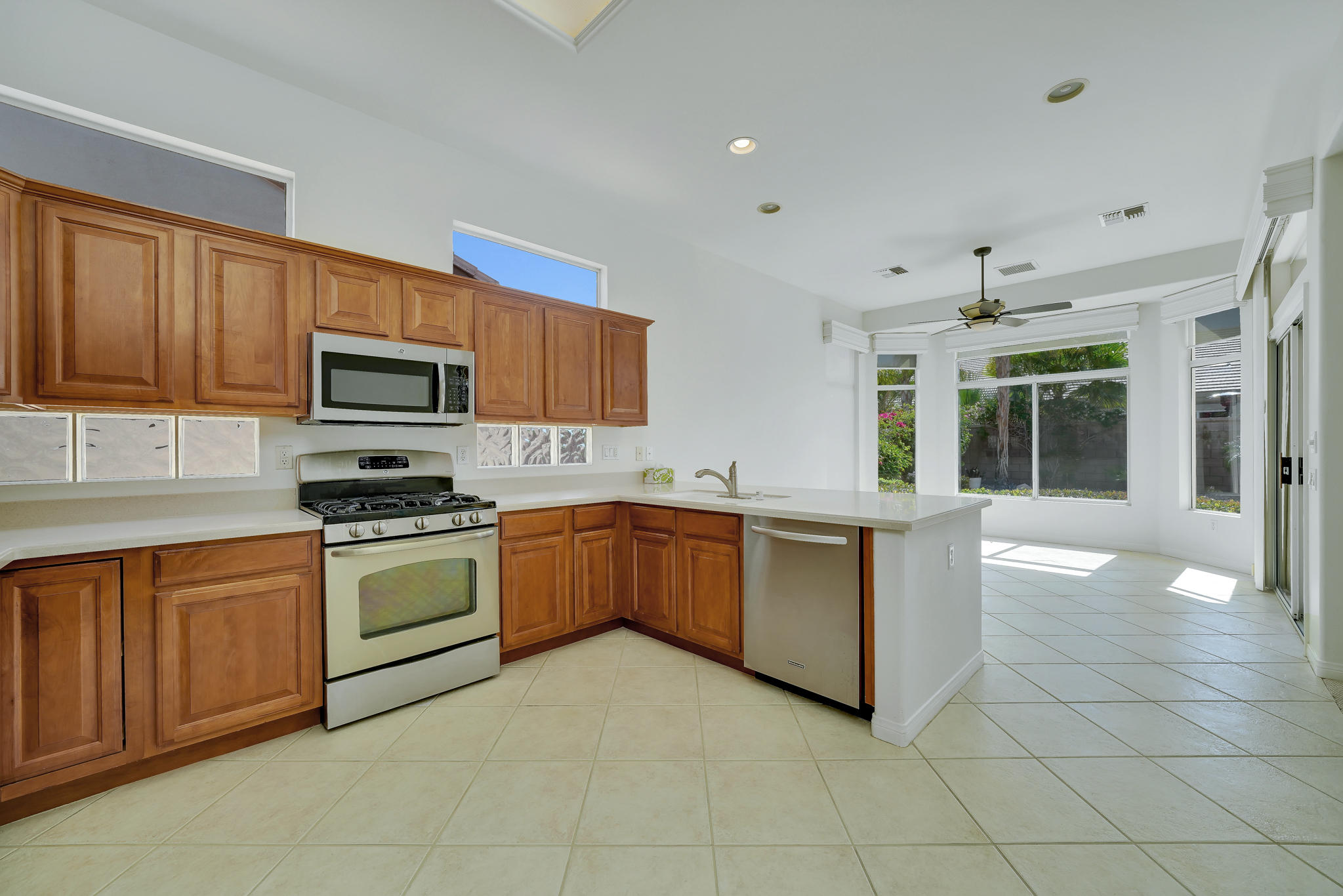 78655 Morning Star Palm Desert, CA 92211 - Photo 10 of 23 a kitchen with a sink counter top space appliances and cabinets