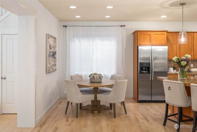 a kitchen with a table and chairs