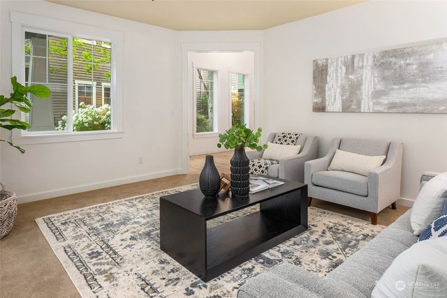 a living room with furniture and windows