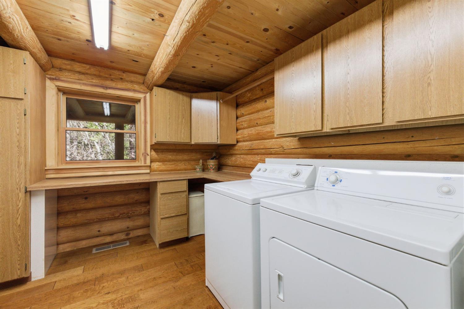 2428 Rancho Paradiso Arnold, CA 95223 - Photo 16 of 67 a view of storage and utility room with washer and dryer
