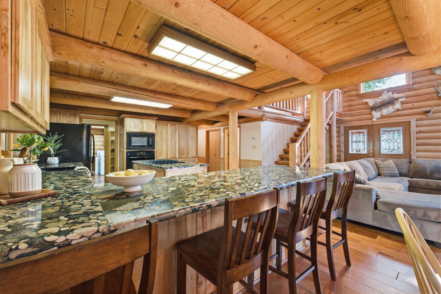 2428 Rancho Paradiso Arnold, CA 95223 - Photo 24 of 67 a view of a dining room with furniture window and wooden floor