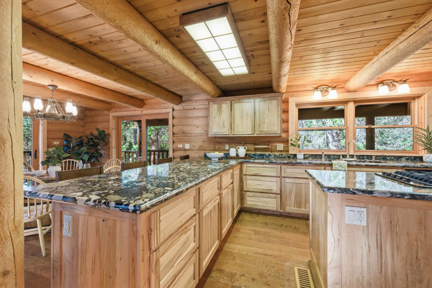 2428 Rancho Paradiso Arnold, CA 95223 - Photo 25 of 67 a kitchen with stainless steel appliances granite countertop a sink and counter space