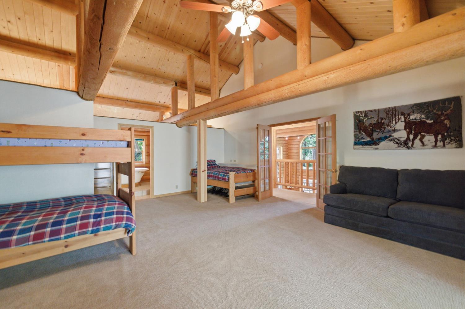 2428 Rancho Paradiso Arnold, CA 95223 - Photo 38 of 67 a bedroom with furniture and a ceiling fan