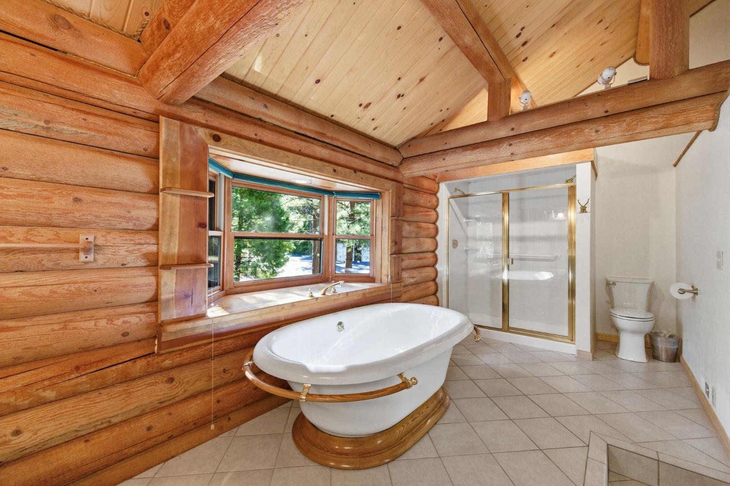 2428 Rancho Paradiso Arnold, CA 95223 - Photo 41 of 67 a bathroom with a tub and shower