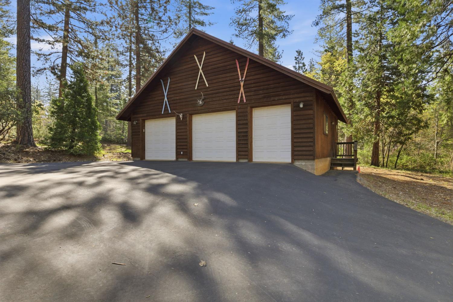 2428 Rancho Paradiso Arnold, CA 95223 - Photo 48 of 67 a view of a house with a small yard and a large tree