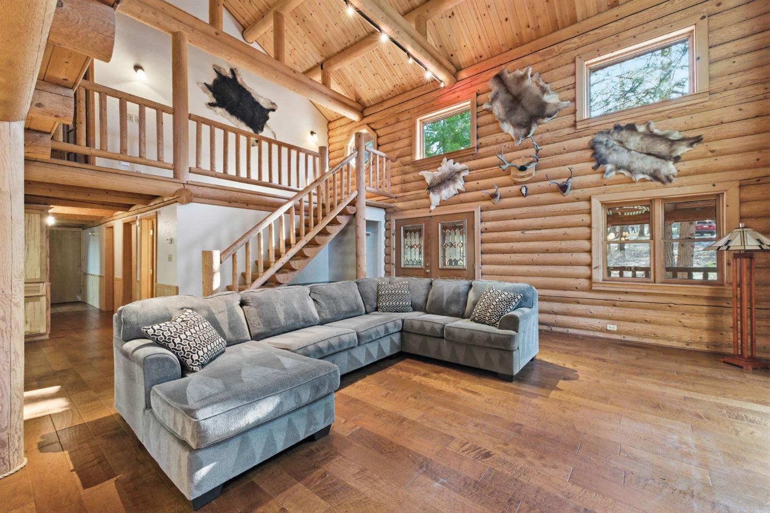 2428 Rancho Paradiso Arnold, CA 95223 - Photo 5 of 67 a view of a livingroom with furniture and stairs