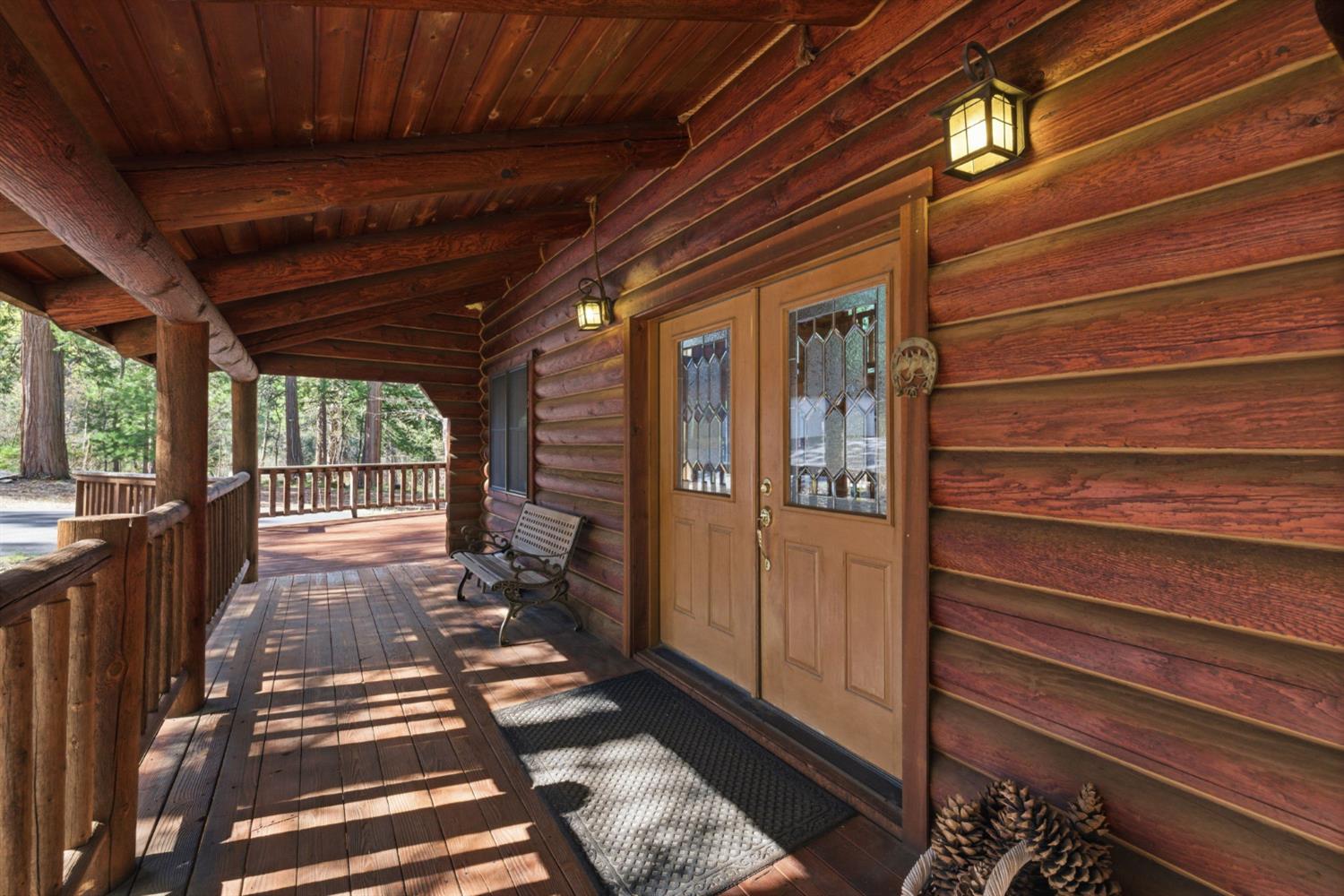 2428 Rancho Paradiso Arnold, CA 95223 - Photo 52 of 67 a view of a porch with wooden floor