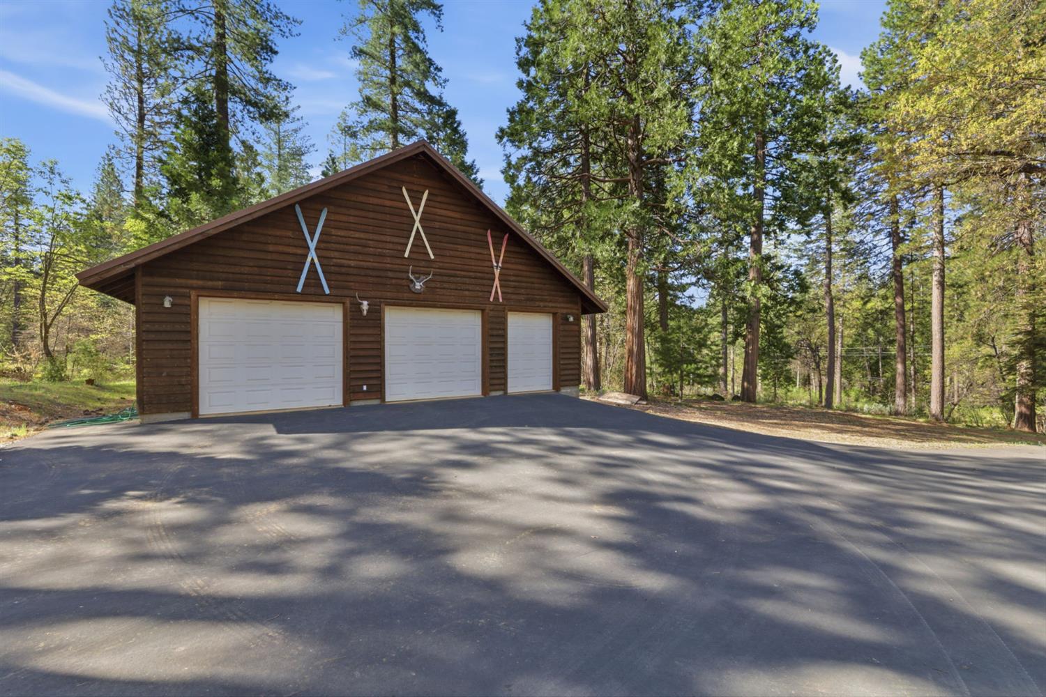 2428 Rancho Paradiso Arnold, CA 95223 - Photo 54 of 67 a view of a house with a yard and large trees