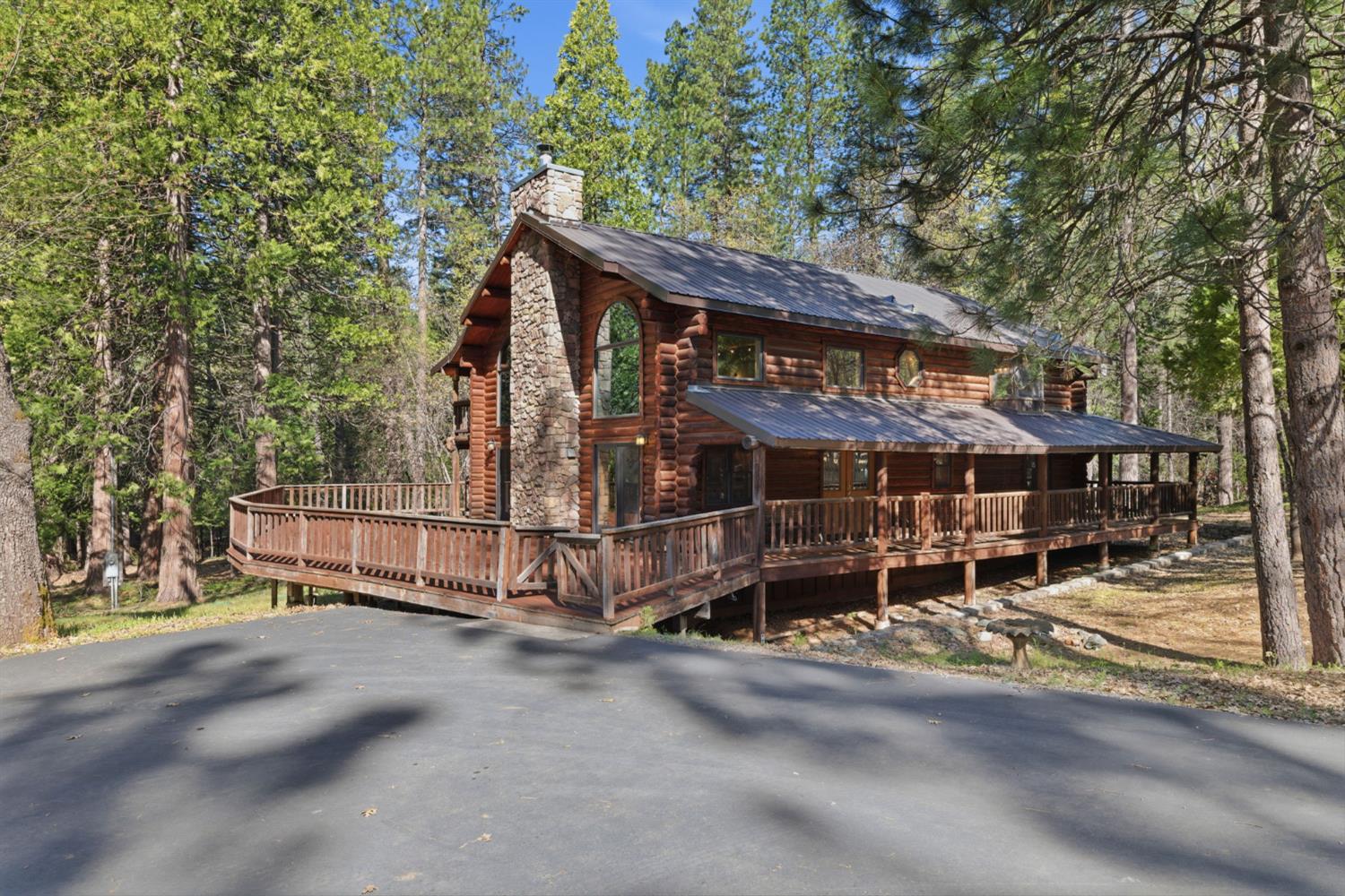 2428 Rancho Paradiso Arnold, CA 95223 - Photo 55 of 67 a view of a house with a wooden fence and a bench