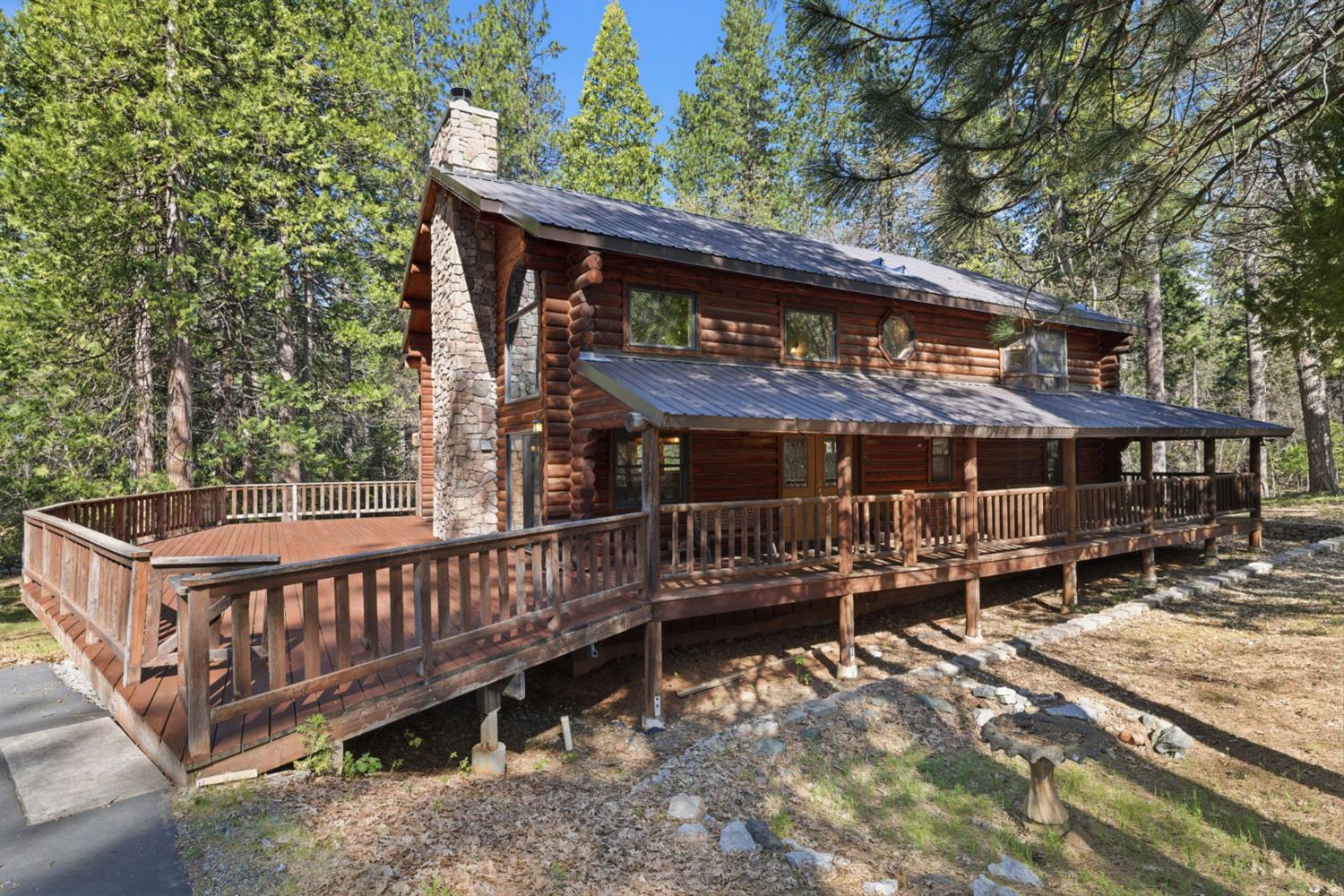 2428 Rancho Paradiso Arnold, CA 95223 - Photo 57 of 67 a view of a house with wooden deck and furniture