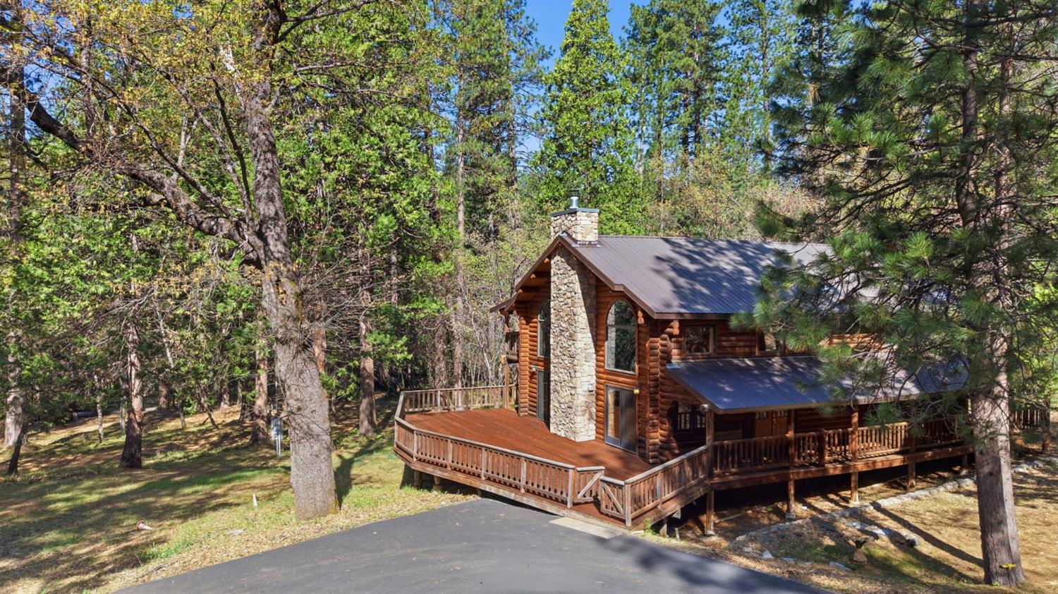 2428 Rancho Paradiso Arnold, CA 95223 - Photo 61 of 67 a view of a chairs setting in the backyard of a house