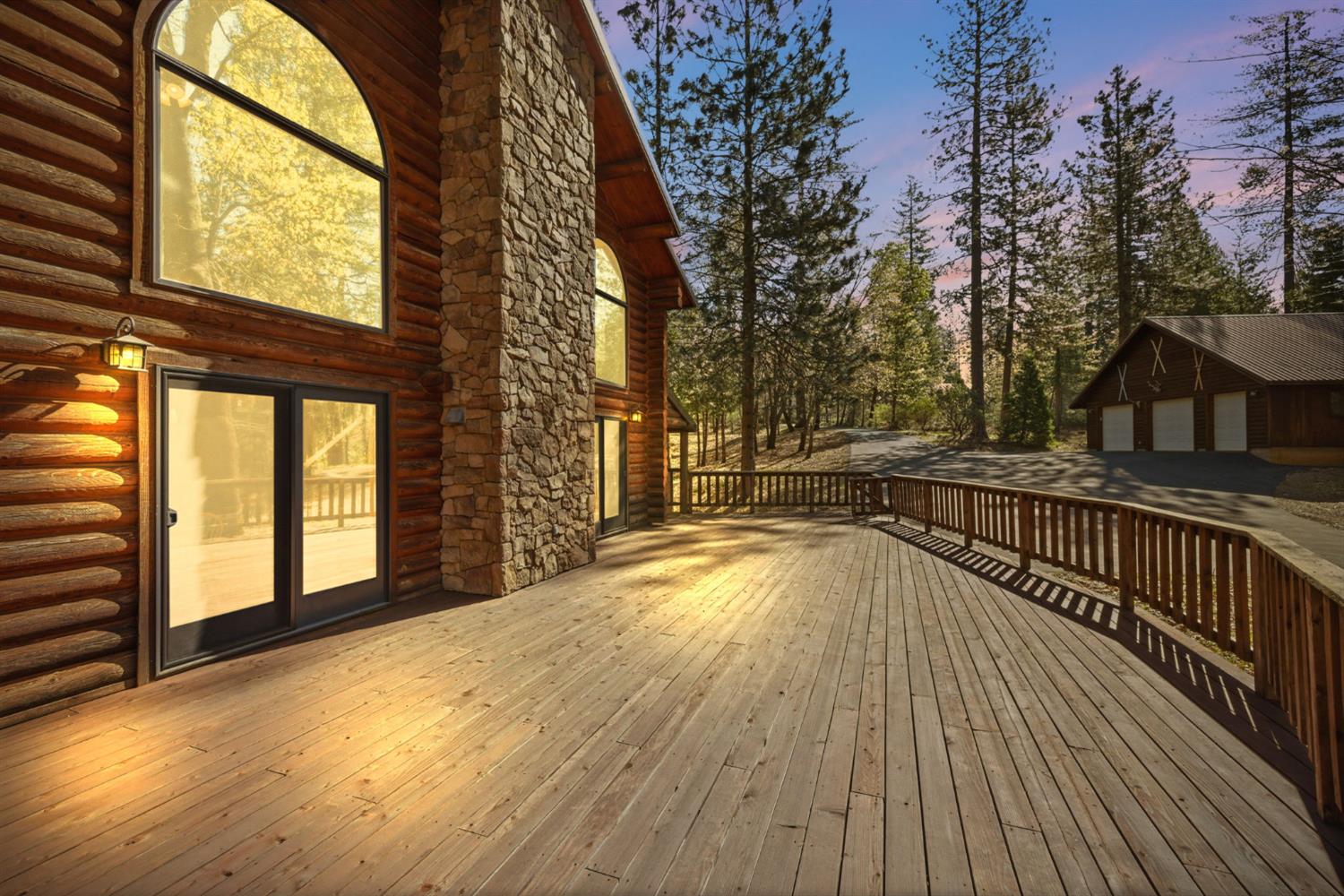 2428 Rancho Paradiso Arnold, CA 95223 - Photo 8 of 67 Relax on the massive front deck, perfectly positioned to enjoy serene wooded views and easy access to the spacious 3-car garage.