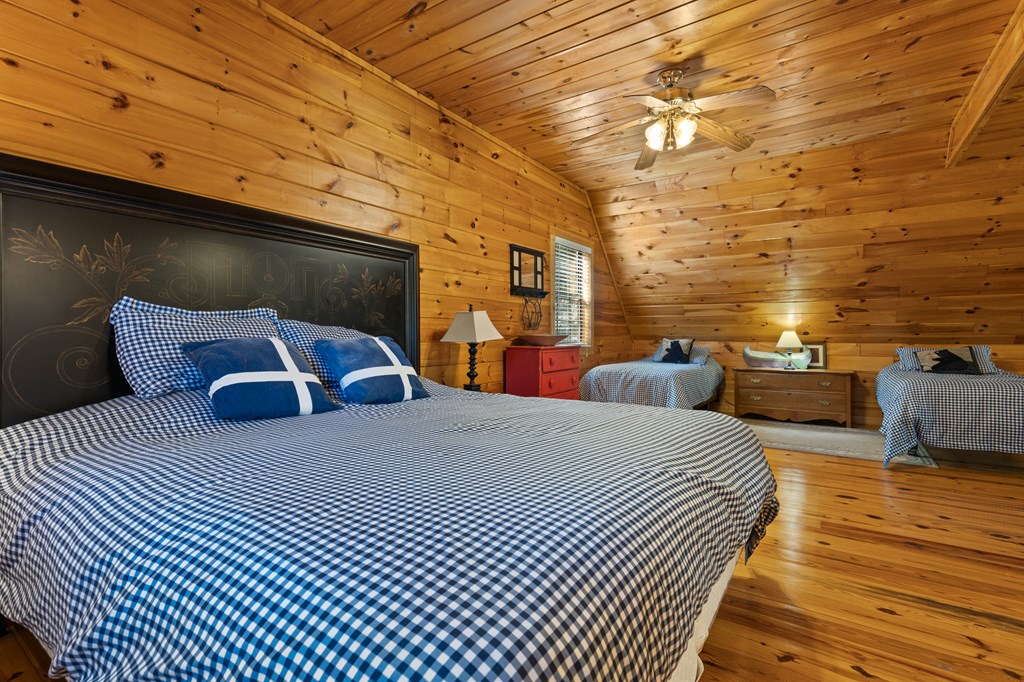 96 Holiday Court Ellijay, GA 30540 - Photo 27 of 51 a bed room with a bed and a night stand