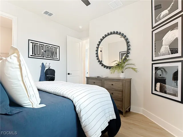 a bedroom with a bed and a dresser