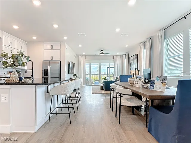 a view of a dining room with furniture and wooden floor