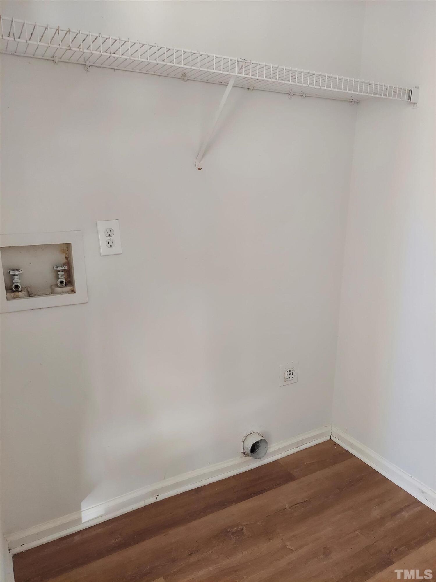 224 Crossfire Road Holly Springs, NC 27540 - Photo 11 of 43 a view of a small space with wooden floor and a window