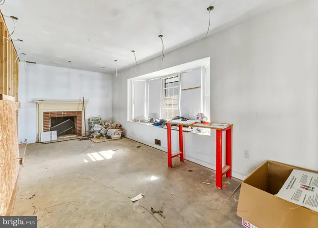 a room with furniture and a fireplace