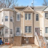 a front view of a building with a street