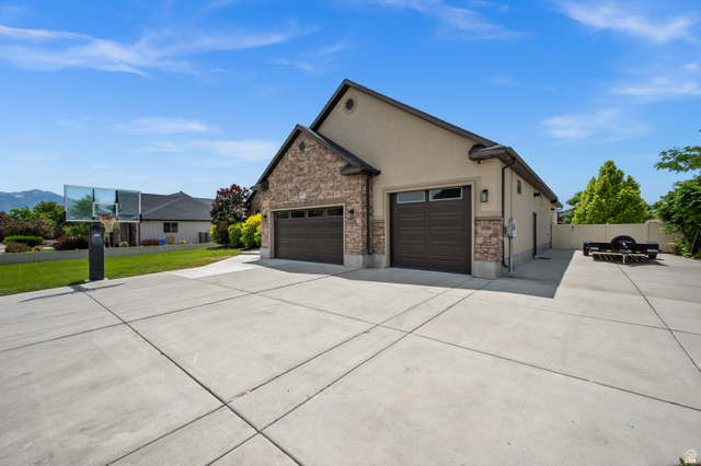 4077 Rons Court Riverton, UT 84096 - Photo 3 of 48 Enjoy the convenience of a 3-car garage and dedicated RV parking.