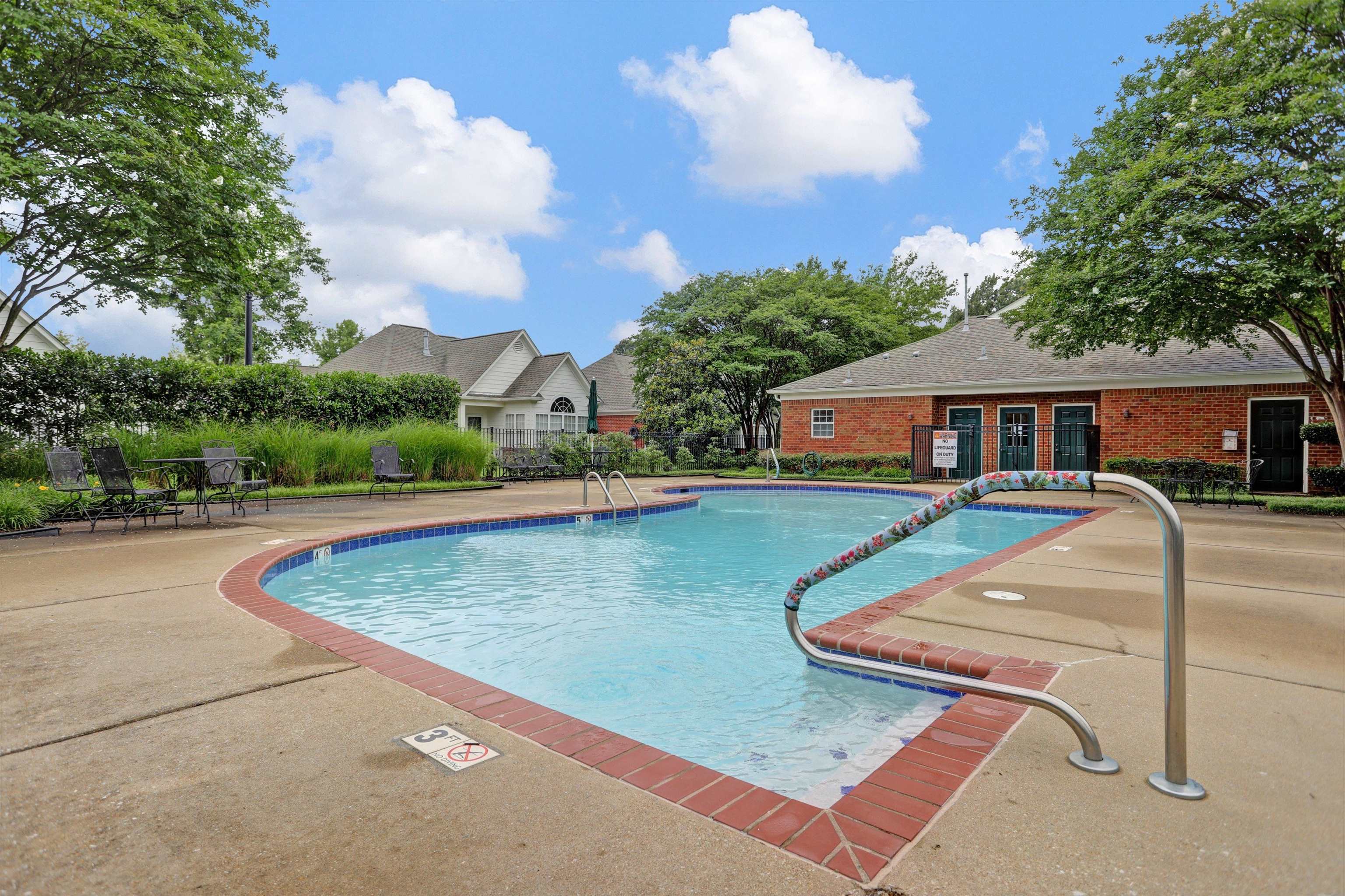 34 Peyton Ridge Drive, Unit 21 Collierville, TN 38017 - Photo 34 of 37 Community swimming pool with a concrete sundeck and brick coping