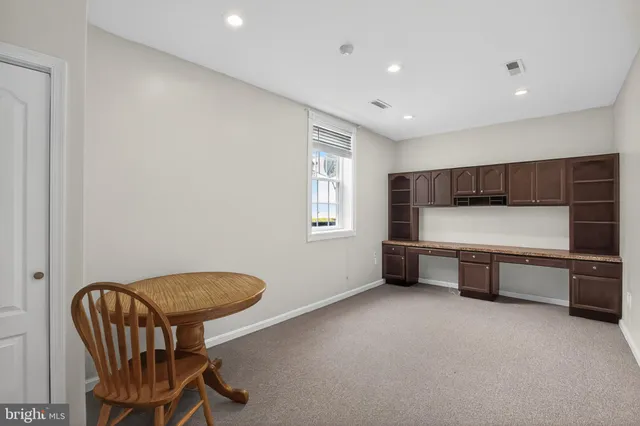 a front view of a house with a yard and porch