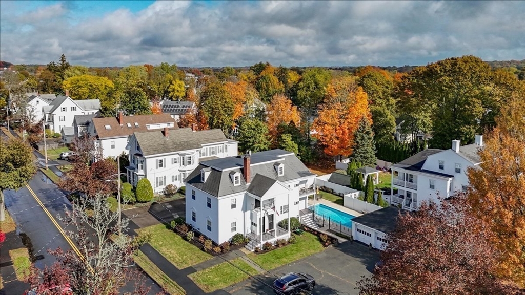 an aerial view of residential houses with outdoor space