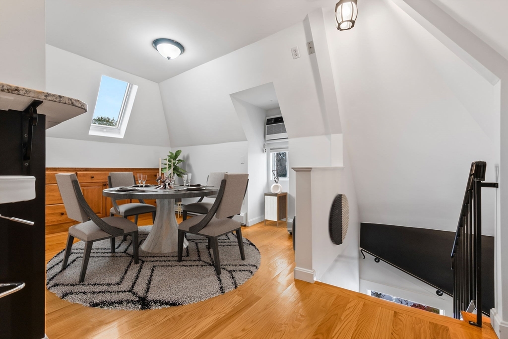 20 Ash Street, Unit 3 Danvers, MA 01923 - Photo 11 of 39 a view of a dining room with furniture and wooden floor