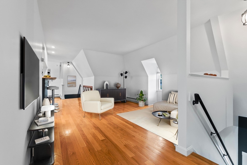 20 Ash Street, Unit 3 Danvers, MA 01923 - Photo 16 of 39 a living room with furniture and a flat screen tv