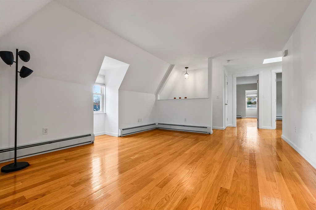 20 Ash Street, Unit 3 Danvers, MA 01923 - Photo 18 of 39 a view of empty room with wooden floor