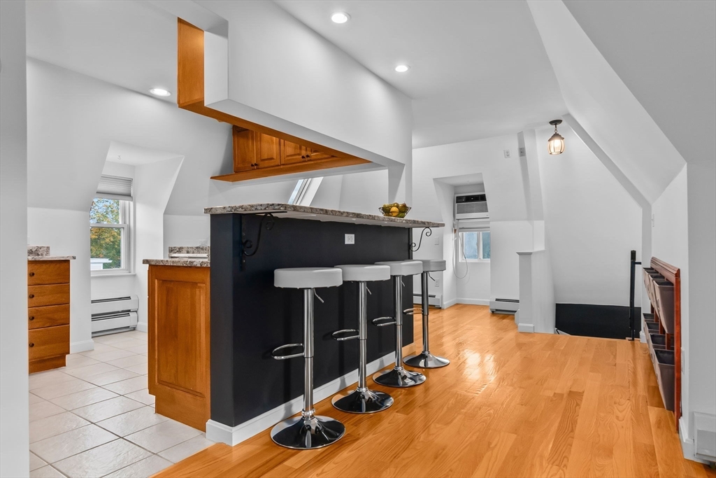 20 Ash Street, Unit 3 Danvers, MA 01923 - Photo 9 of 39 a view of living room with furniture and a flat screen tv