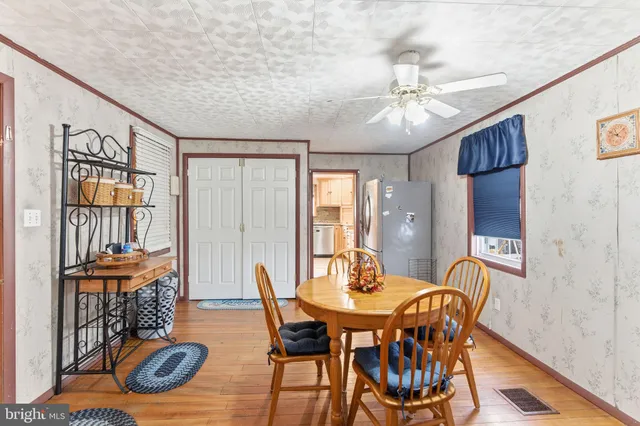 a kitchen with granite countertop a sink stainless steel appliances and cabinets