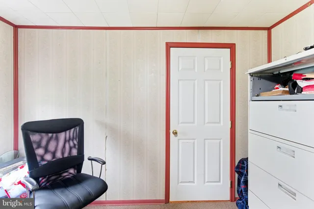 a living room with a flat screen tv and a fireplace